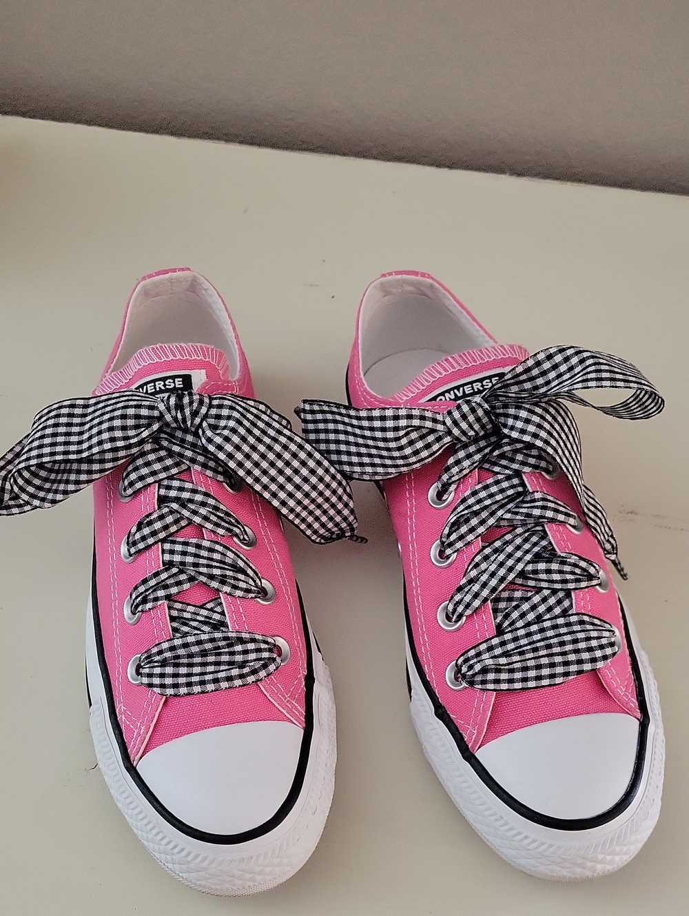 Converse Pink Low-Top Sneakers with Black-and-White Gingham Laces